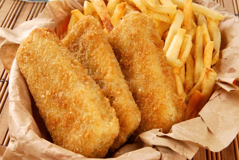 Breaded fish sticks and french fries royalty free stock photography