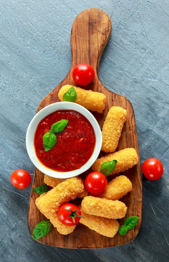 Breaded Mozzarella Cheese Sticks with Tomato Basil Sauce Stock Image