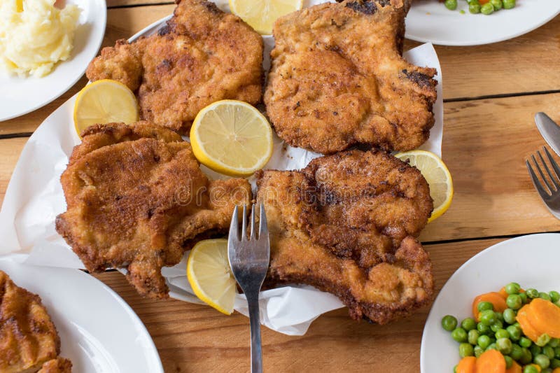 Breaded Pork Chops on a Dinner Table Stock Photo - Image of closeup