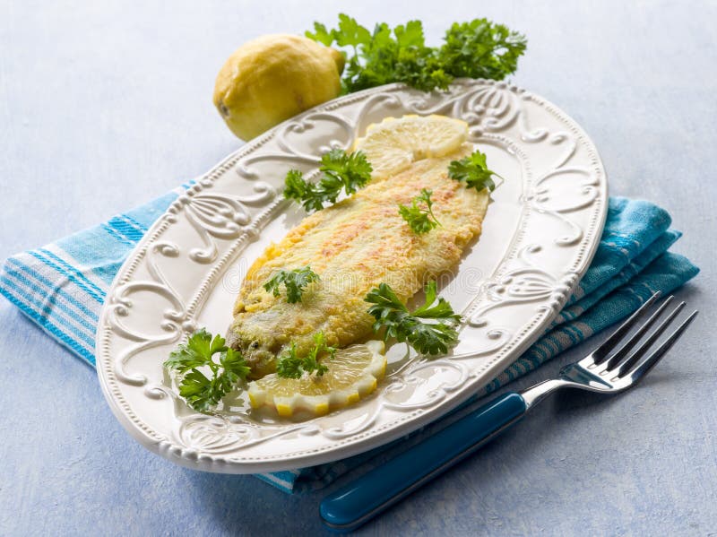 Breaded sole fish with parsley royalty free stock image