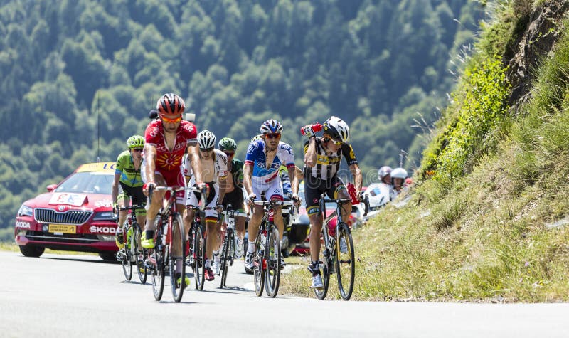 Col D'Aspin,France- July 15,2015: The breakaway climbing the road to Col D'Aspin in Pyrenees Mountains during the stage 11 of Le Tour de France 2015. Col D'Aspin,France- July 15,2015: The breakaway climbing the road to Col D'Aspin in Pyrenees Mountains during the stage 11 of Le Tour de France 2015.