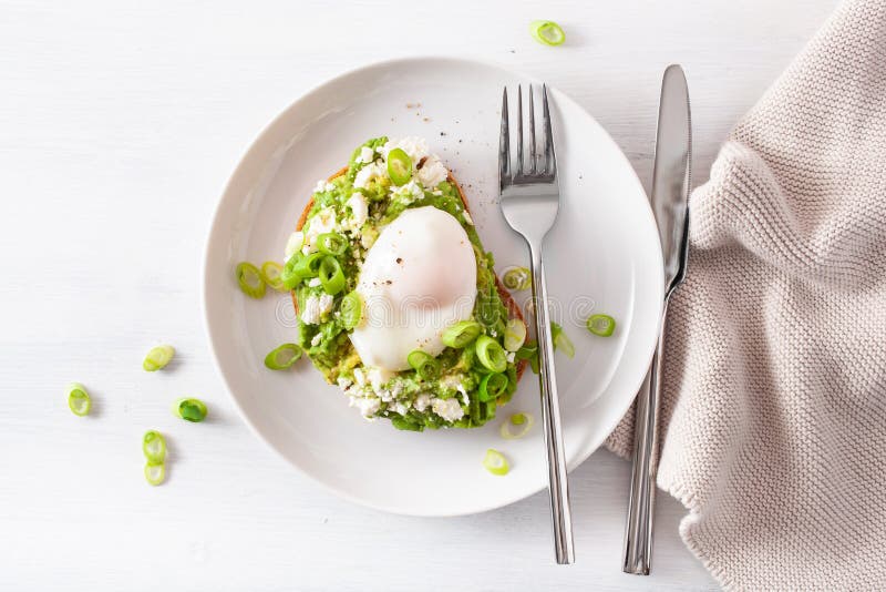 Breakfast Avocado Sandwich With Poached Egg And Feta Cheese Stock Image