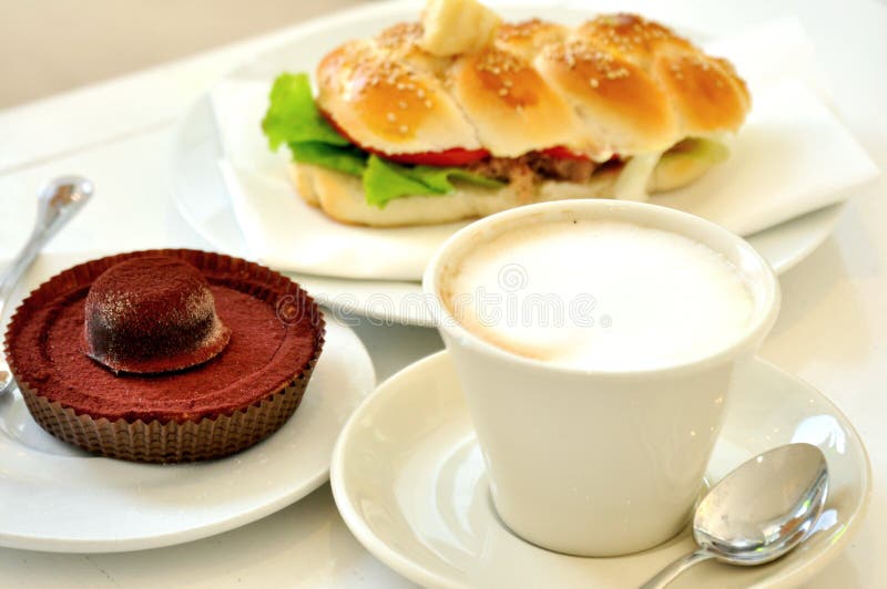 Breakfast with cappuccino and chocolate cake