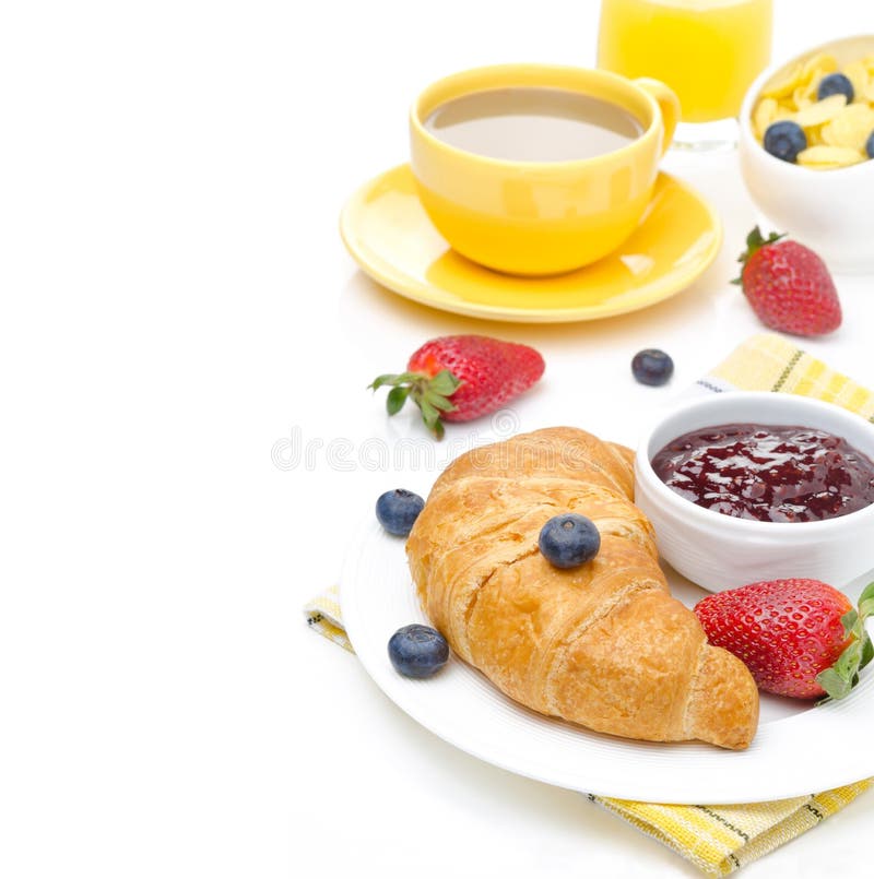 Breakfast with croissant, jam, fresh berries, coffee