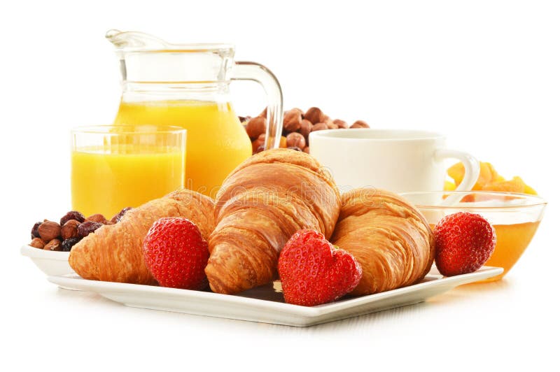 Breakfast with croissants cup of coffee and fruits