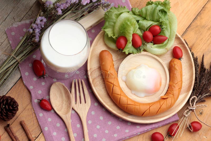 Breakfast with Eggs, Sausage, Salad Vegetables and Milk. Stock Image