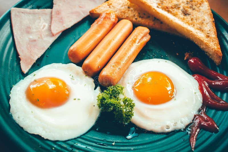 Breakfast with Fried Eggs, Bacon and Sausages. Stock Image Image of
