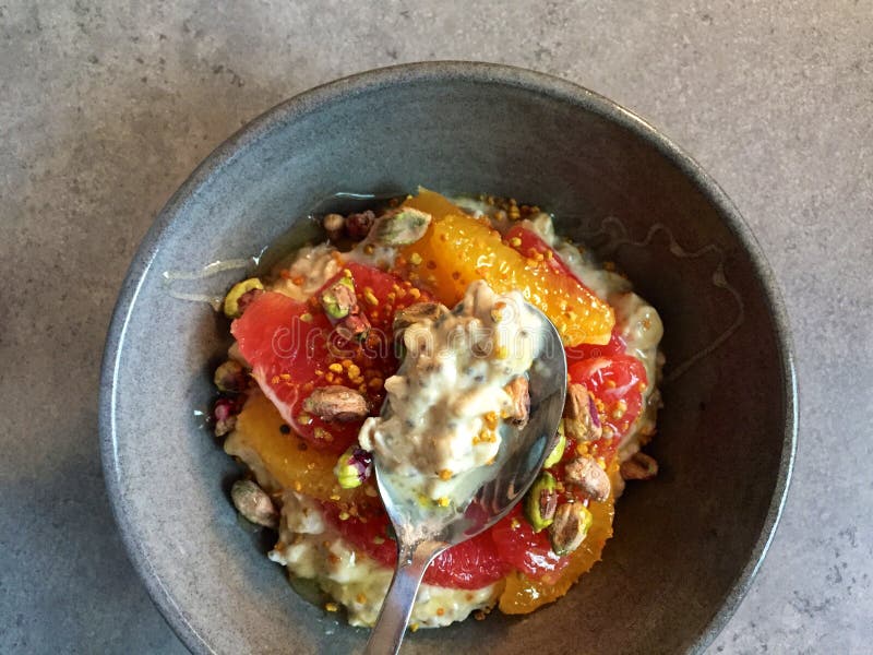 Breakfast: Kefir muesli with grapefruit, orange segments, pistachios, bee pollen