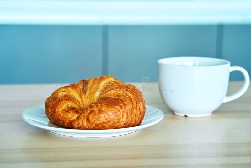 Breakfast in the Morning. Croissant and a Cup of Coffee Stock Image
