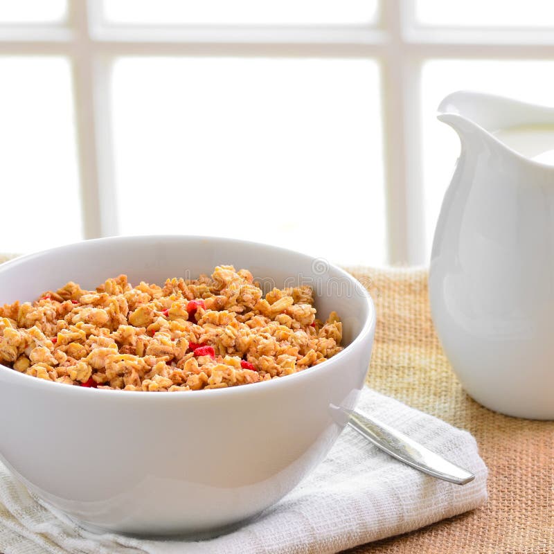 Breakfast Muesli Cereal Clusters with a Jug of Fresh Milk. Stock Image