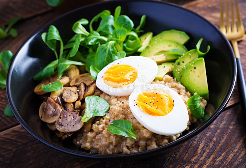 Breakfast Oatmeal Porridge with Boiled Egg Avocado and Fried Mushrooms ...