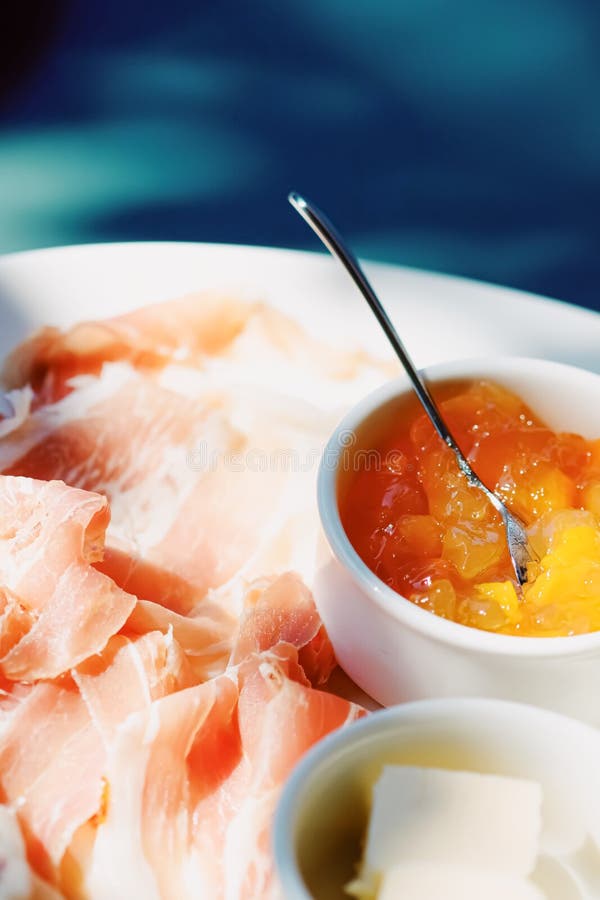 Breakfast Outdoors in Summer, Ham, Jam, Butter and Ham Stock Photo