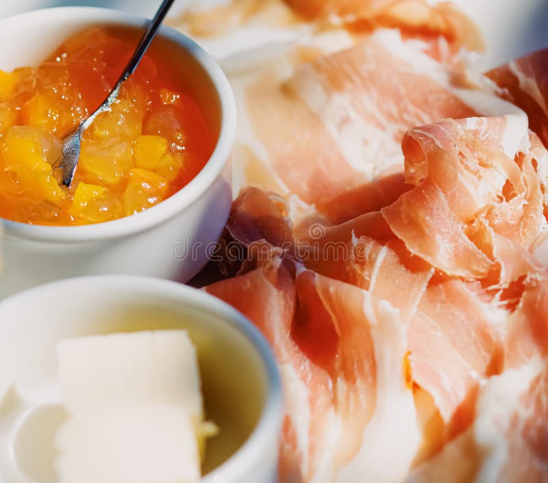 Breakfast Outdoors in Summer, Ham, Jam, Butter and Ham Stock Photo