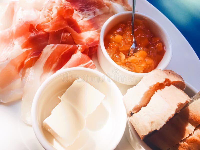 Breakfast Outdoors in Summer, Ham, Jam, Butter and Ham Stock Photo