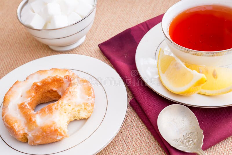 Breakfast with Pastries, and Hot Tea with Lemon. Stock Photo Image of