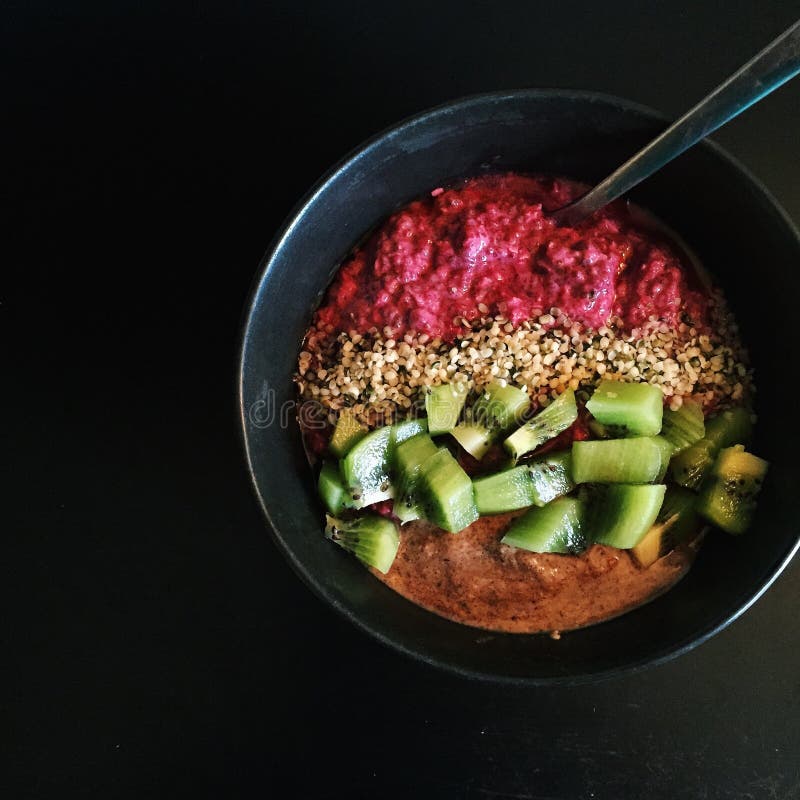 Breakfast: Raspberry chia bowl with kiwifruit, hemp seeds, hazelnut butter