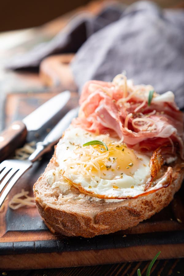 Breakfast Sandwich. Scrambled Eggs and Jamon on Whole Grain Bread Stock