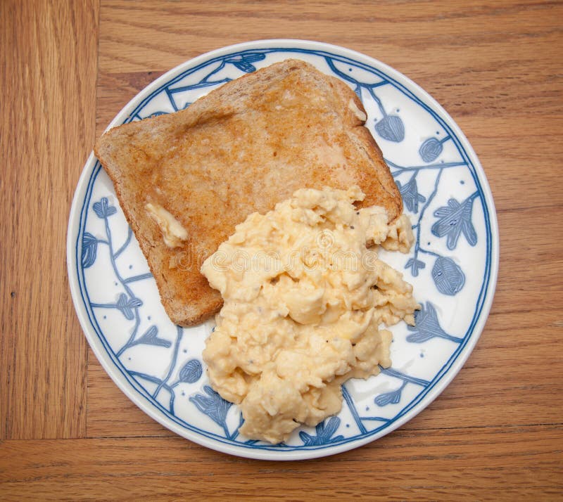 A Breakfast of Scrambled Eggs on Toast Stock Image - Image of bread