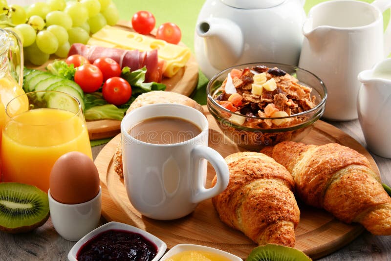 Breakfast Served with Coffee, Orange Juice, Egg and Fruits Stock Photo
