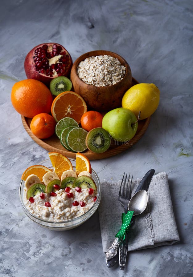 Breakfast still life with oatmeal porridge, fruits and coffee cup, top view, selective focus, shallow depth of field. royalty free stock photography Breakfast still life with oatmeal porridge, fruits and coffee cup, top view, selective focus, shallow depth of field. royalty free stock photography