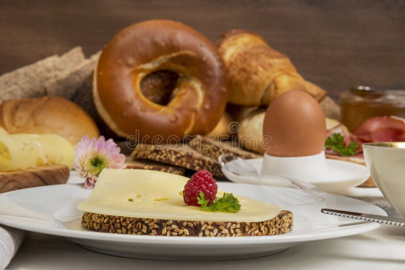 Breakfast Table with Cheese Bread, Coffee, Egg, Ham and Jam Stock Photo