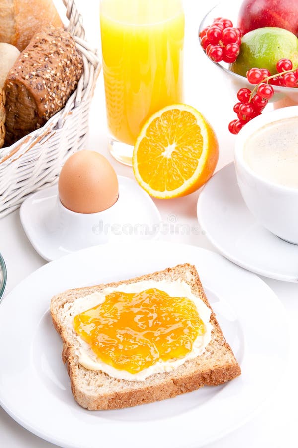 Breakfast table with toast and orange marmelade