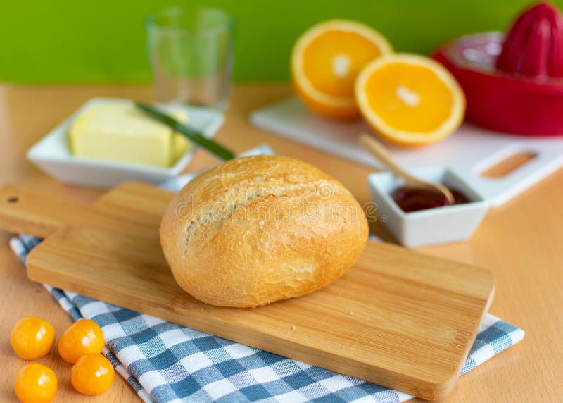 Breakfast Table with Wheat Rolls, Jam, Butter and Fruit Stock Photo ...