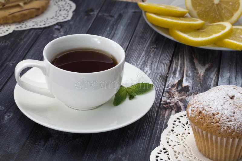 Breakfast - tea with cupcakes stock image