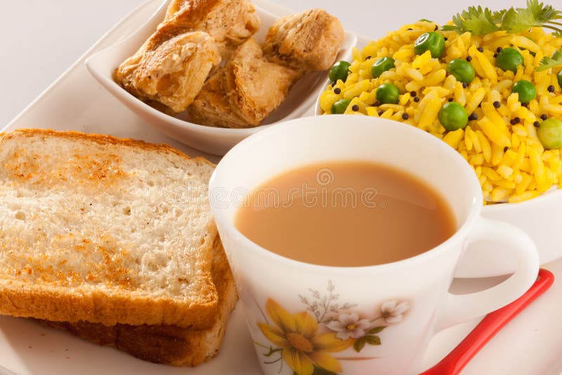 Breakfast Tea, Poha with Bread and Biscuit. Stock Photo Image of