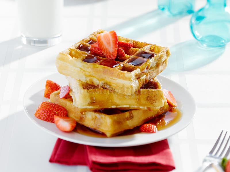 Breakfast - waffles with syrup and strawberries