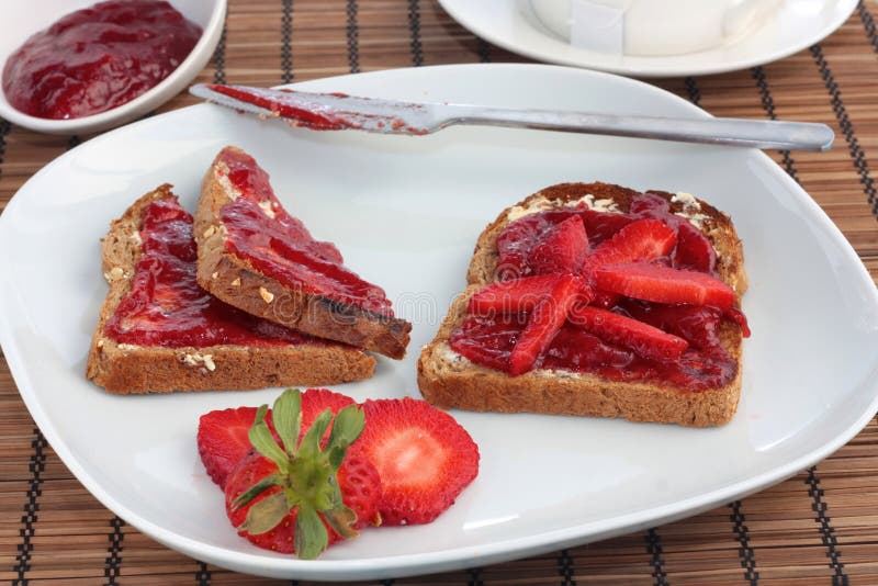 Breakfast of wholemeal toast with strawberry jelly