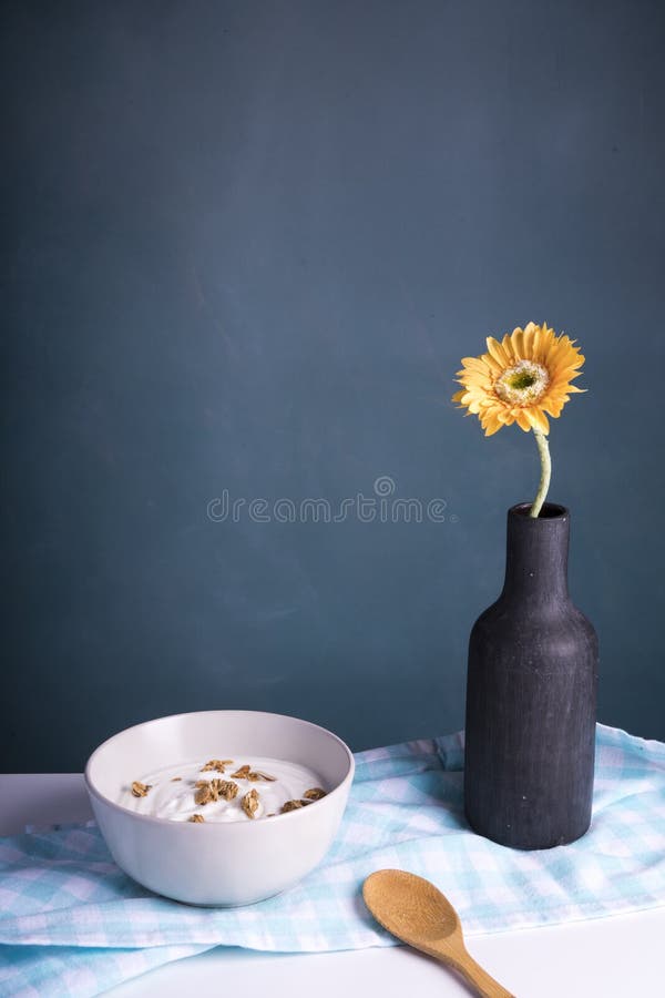 Breakfast with yoghurt and cereals, dark background stock images Breakfast with yoghurt and cereals, dark background stock images