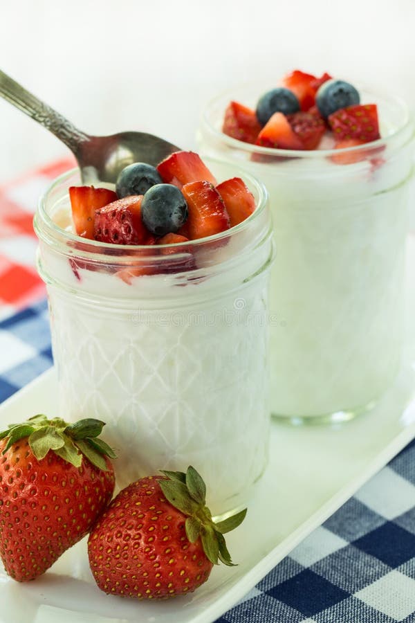 Breakfast Yogurt with Strawberries and Blueberries with Spoon Stock