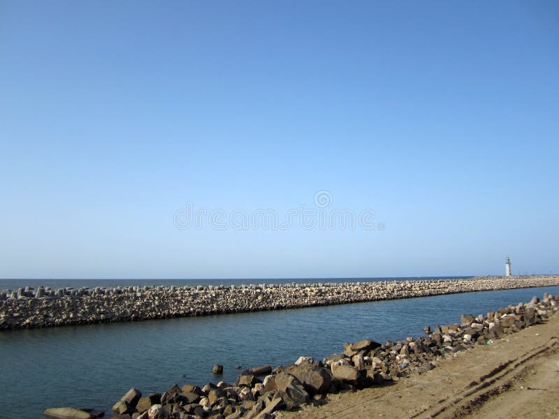 Breakwater and lighthouse stock image. Image of rock - 24019769