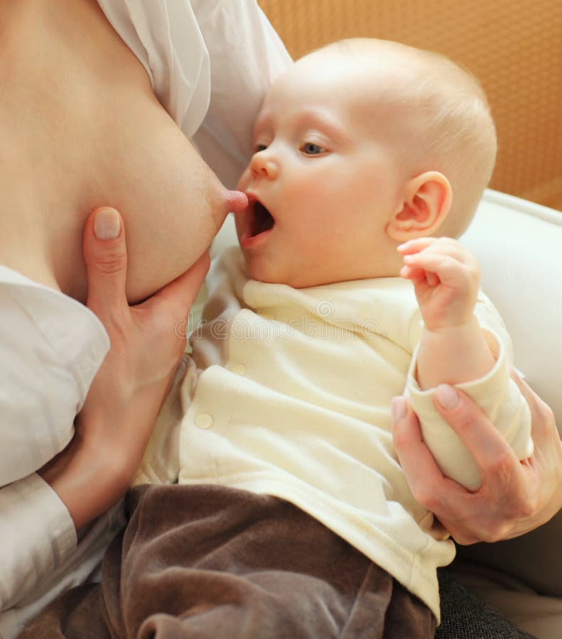 Mother Feeding Child. Image & Photo (Free Trial)