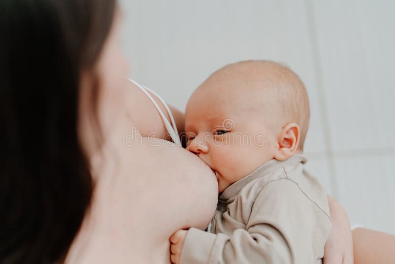 Nudist female breastfeeding