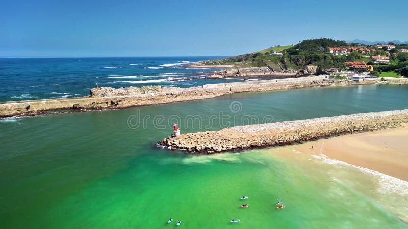 A stunning aerial view of a coastal landscape with a picturesque lighthouse and vibrant green waters. Lighthouse viewpoint stock images, royalty-free photos and pictures