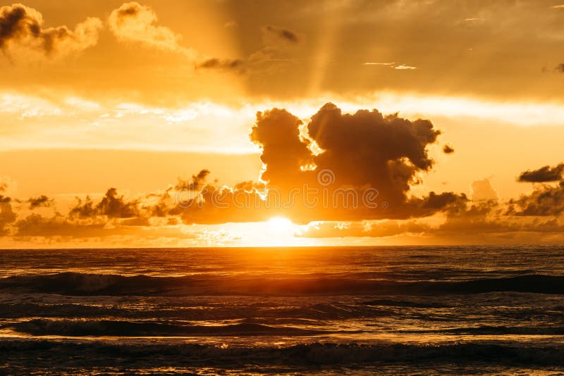 Breathtaking Sunset Scenery With The Golden Sky Over The Ocean Stock
