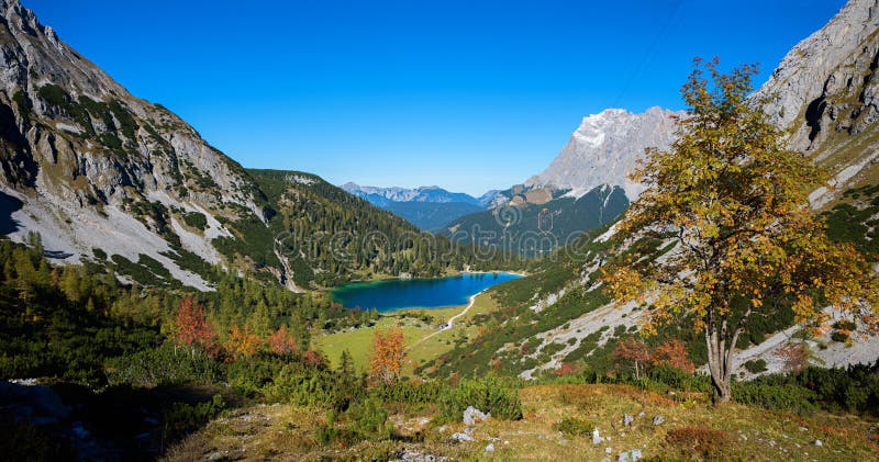 Breathtaking view from the hiking trail to alpine landscape with seebensee and zugspitze mountain in autumn royalty free stock image Breathtaking view from the hiking trail to alpine landscape with seebensee and zugspitze mountain in autumn royalty free stock image