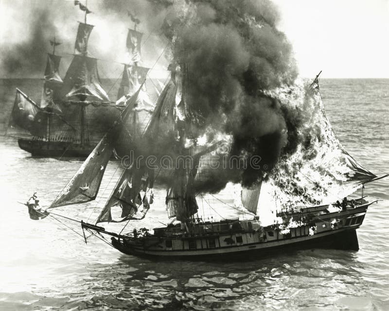 Burning boat in the middle of the ocean. Burning boat in the middle of the ocean