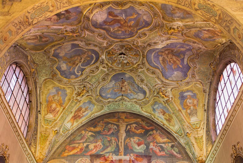 BRESCIA, ITALY - MAY 22, 2016: The ceiling baroque frescoes of side chapel and gothic-renaisscane fresco of Crucifixion by Andrea Bembo 1475 in church Chiesa di Santa Agata. BRESCIA, ITALY - MAY 22, 2016: The ceiling baroque frescoes of side chapel and gothic-renaisscane fresco of Crucifixion by Andrea Bembo 1475 in church Chiesa di Santa Agata.