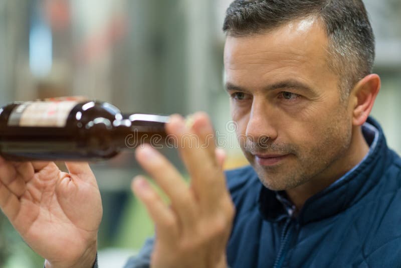 Brewery Worker Inspecting Beer Bottle Stock Image Image of working