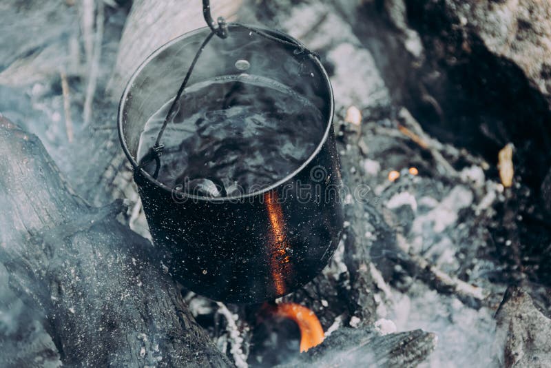 https://thumbs.dreamstime.com/b/brewing-boiling-water-tourist-pot-over-hearth-cooking-soup-metal-pan-fire-survival-wild-warming-hot-drink-246377860.jpg