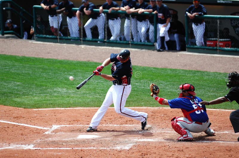 LAKE BUENA VISTA, FL - MARCH 24: Atlanta Braves catcher Brian McCann connects on a pitch in a March 24, 2010 spring training game in Lake Buena VIsta, FL