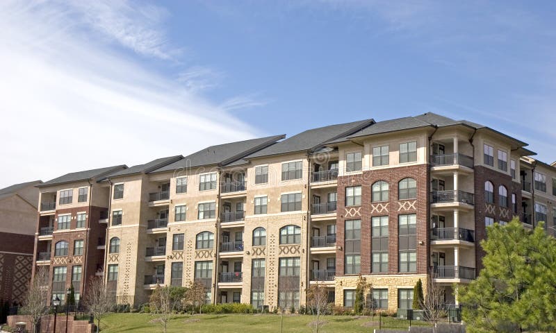 Brick Apartments and Clouds