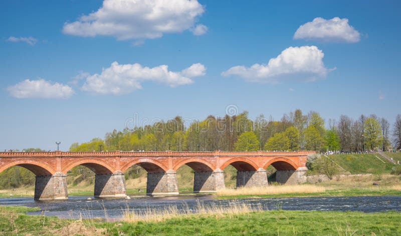 Brick bridge across the Venta River in the city of Kuldiga in Latvia stock photos Brick bridge across the Venta River in the city of Kuldiga in Latvia stock photos