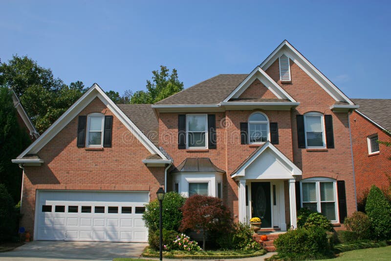 Nice Brick House With A Brown Door Stock Photo Image of window