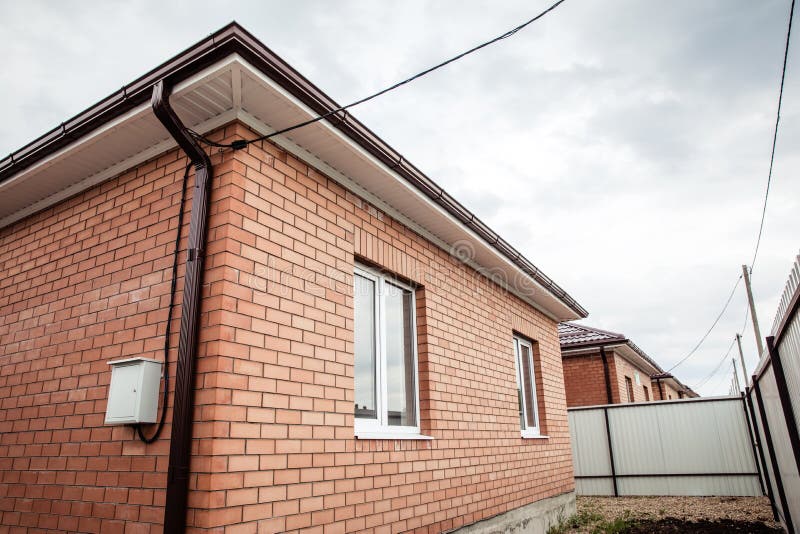 Brick house Wall Facade. construction of houses. cottage red brick house