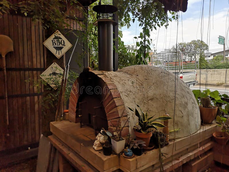 Brick Pizza Oven,Cooking Italian Pizza in a Brick Oven Stock Image