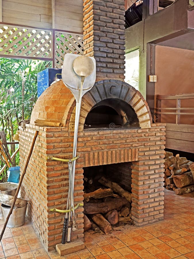 Brick Pizza Oven with Pizza Peel and Firewood Stock Photo Image of